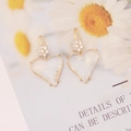 Detail of gold heart earrings with zircon flowers and transparent heart drop pendants - White