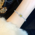Silver bracelet with rectangular yellow zircon and pavé stones on a female wrist - Yellow Crystal Square Bracelet (A2113)