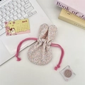 Detailed view of pink floral drawstring storage bag with cute rabbit ear decoration - Colorful Floral