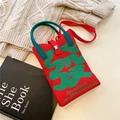 Detail of red and green knit phone bag with 'FA' character and good luck slogan - Prosperity Character Red Green