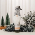 Detail view of a Christmas gnome wine bottle cover with grey knitted hat and white beard - C2-2 Grey Gnome Bottle Cover