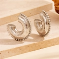 Macro detail of silver hammered C-shape earrings featuring sparkling zircon borders - Hollow Rhinestone Silver Hammered Style (F708)