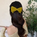 Vintage mustard yellow velvet bow hair clip worn by model on a half-up hairstyle - Twist Clip / Yellow