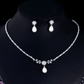 Elegant silver jewelry set with white pearl necklace and matching teardrop earrings - Two-Piece Set