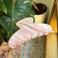 Close-up of pink and white marble texture acetate hair claw clip with large teeth - Large / Slanted Pink Buttercream