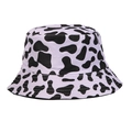 Reversible bucket hat with light purple base and black cow print pattern - One Size / Lavender