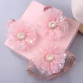Close-up of pink tulle flower hair accessories set with pearls and sequins for babies - Style 40 (Pink Mesh Flower Shoe/Headband)