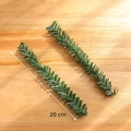 Artificial 20cm green pine branches for Christmas DIY decor on light wood background - PVC Christmas Leaf L (Set of 2)