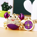 Sparkling rhinestone crab keychain in purple and gold with a Chinese fortune coin tag - Purple Lucky Crab with Coin
