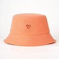 Close-up of heart embroidery on orange cotton bucket hat with parallel stitched brim - M (56-58cm) / Orange