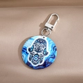 Macro shot of Hamsa hand key ring with marble pattern and evil eye symbol charm - Blue and White Ocean Style Hamsa Hand