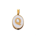 Detailed macro view of 22mm oval shell pendant with golden letter Q engraving - Gold Letter Q