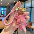 Pink resin yarn-textured bear keychain with woven strap and golden bell charm - Knit Bear-Pink