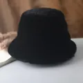 Detail of soft black faux fur bucket hat with dense texture for winter warmth - 56-58cm (One Size) / Black