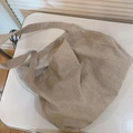 Close-up of a large beige canvas tote bag with textured fabric for daily casual use - Solid Beige