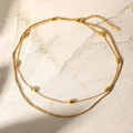 Collar de doble capa de acero inoxidable bañado en oro de 18k con cuentas elegantes - Estilo de Perla Ovalada de Doble Capa Dorada (JDN20665)
