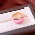 Close-up of a pink enamel chunky gold ring presented in a brown jewelry box - Gold-Pink