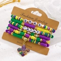 Vijfdelige Mardi Gras kralenarmbandset met paarse iris bedel en gekleurde polymeerklei - Driekleur Met Lelie (02)