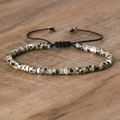 Adjustable woven bracelet with beige spotted natural stone beads and silver spacers - No.34 Dalmatian Jasper