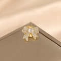 Golden bow brooch with white zircons and cat eye stone in a minimalist style - Fashion Bowknot