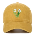 Detail of floral embroidery on vintage washed cotton baseball cap with curved brim - Yellow