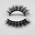 Close-up of thick curly black faux mink eyelashes on a clean white background - D1010