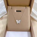 Macro shot of silver butterfly necklace with white shell pendant in a jewelry box - Mother of Pearl Butterfly Pendant Silver (N207)