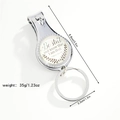 Detail view of nail clipper keychain with dimensions 8.8cm and religious quote - Be still and know that I am God