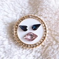 Detail of round brooch with blue and pink rhinestones, faux pearls, and gold trim - Gold-White Face (22)