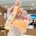 Orange bubble tea bear keychain with floating beads and a Happy silicone strap - Candy Bag - Orange