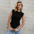 Slim fit black sleeveless ribbed knit top for women paired with casual denim jeans - Black