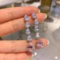 Macro view of tiered silver drop earrings with stacked clear and pink crystals - Pink Zirconia Dangle Earrings 8X10