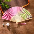 Pink and green gradient folding fan with cherry blossom patterns and a pink silk tassel - 03 Cherry Moon