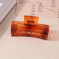 Matte amber rectangular hair claw clip for thick hair, shown on a minimalist table - #48 Glossy Strip - 10.5cm / Bulk (No Packaging)