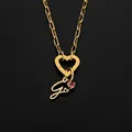 Stainless steel initial G pendant necklace featuring heart clasp and pink stone detail - Letter G