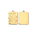 Detail of double-sided 14K gold Aries pendant with vibrant crystals and smooth back - Virgo