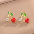 Elegant gold cherry earrings with red heart gems and green leaves on beige base - Cherry Stud Earrings (440) / Gold