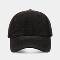 Detailed view of washed cotton fabric with distressed vintage holes on a baseball cap - Black
