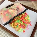 Macro detail of high-elasticity colorful hair ties in a frosted zipper bag with bird motif - Neon Multicolor Style 1-Thin (One Bag)