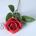 Single red velvet artificial rose with green stem and leaves on a clean white background - Red