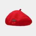 Close-up of red wool beret featuring delicate cherry embroidery detail for women - One Size / Red