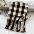 Black white and mustard yellow plaid scarf with fringe tassels on a mesh display - Coffee White