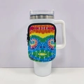 Detail of white 40oz tumbler sleeve featuring a vibrant rainbow tie-dye zipper pouch - No. 2 Swirl Face