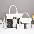 Three-piece women's handbag set in white snakeskin pattern with elegant gold hardware - White