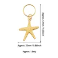 Macro view of gold starfish pendant showing dimensions 42mm height and 22mm width - Starfish