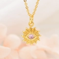 Macro detail of golden sunflower necklace with pink zircon evil eye stone pendant - K303 Pink Eye Pendant And Chain (ZYN-DMK303G)