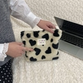 Detail of soft leopard heart plush makeup bag with woven label and zipper closure - Champagne Hearts