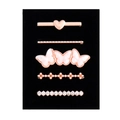 Macro detail of 5 rose gold decorative metal loops for silicone watch bands - D3033 Resin Butterfly/Heart Set 23