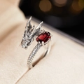 Macro shot of adjustable silver dragon ring with red oval garnet gemstone and scale texture - Natural Garnet Vintage Dragon Ring LR258