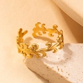 Elegant gold titanium steel wave ring with an adjustable open design on a stone base - Leaf Gold 78